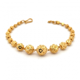 Elegant Gold Bracelet with Intricate Details  - 7 inch