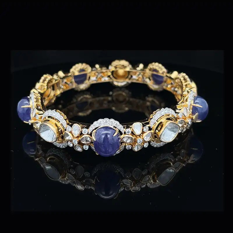 Pair of stunning bangles with uncut diamonds and gemstones