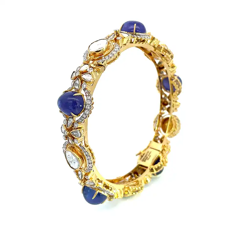 Pair of stunning bangles with uncut diamonds and gemstones