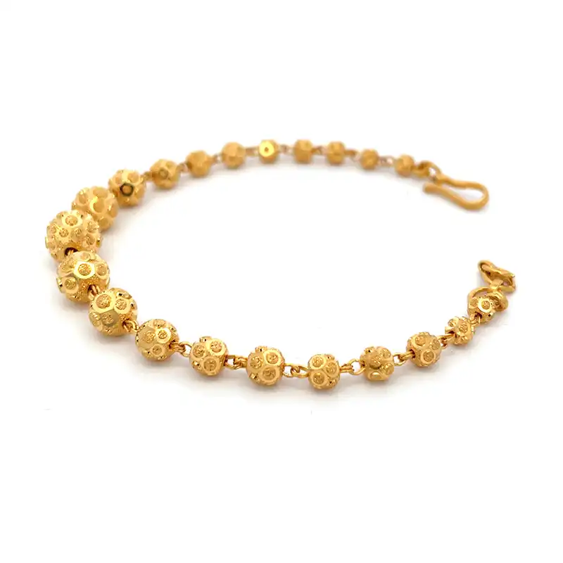 Elegant Gold Bracelet with Intricate Details  - 7 inch