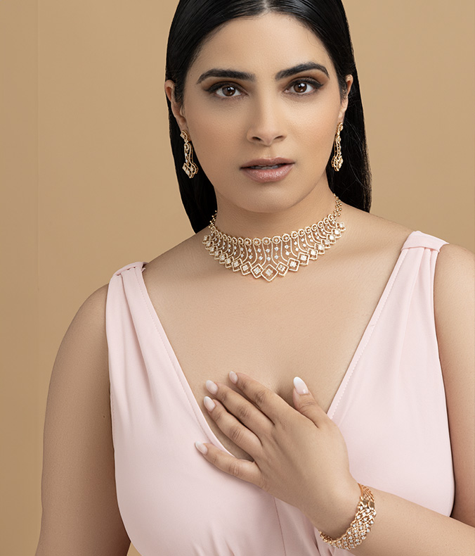 Beautiful girl with set jewelry . Woman in a necklace with a ring, earrings  and a bracelet. Beauty and accessories. Stock Photo